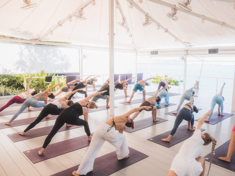 Yoga session in the White Prana Sala overlooking the ocean